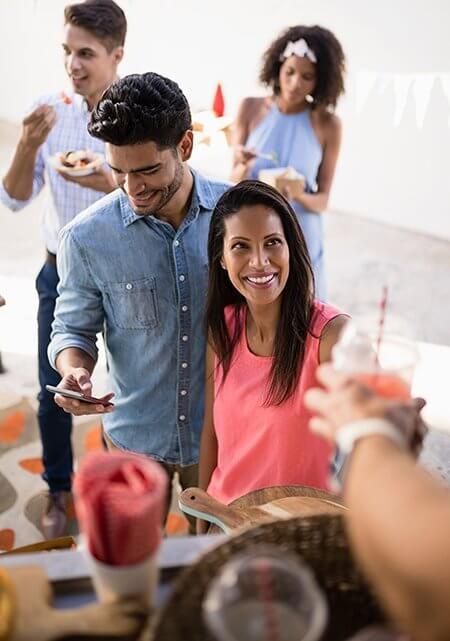 Customers giving order at food truck counter